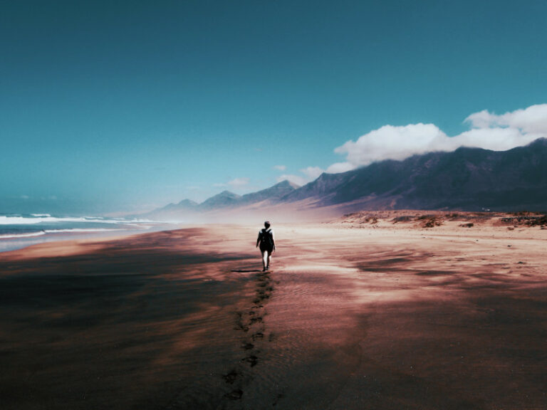 Walking alone on a stormy beach